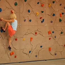 Climber climbing on Composite DIY Climbing Panels produced and sold by EP Climbing Walls